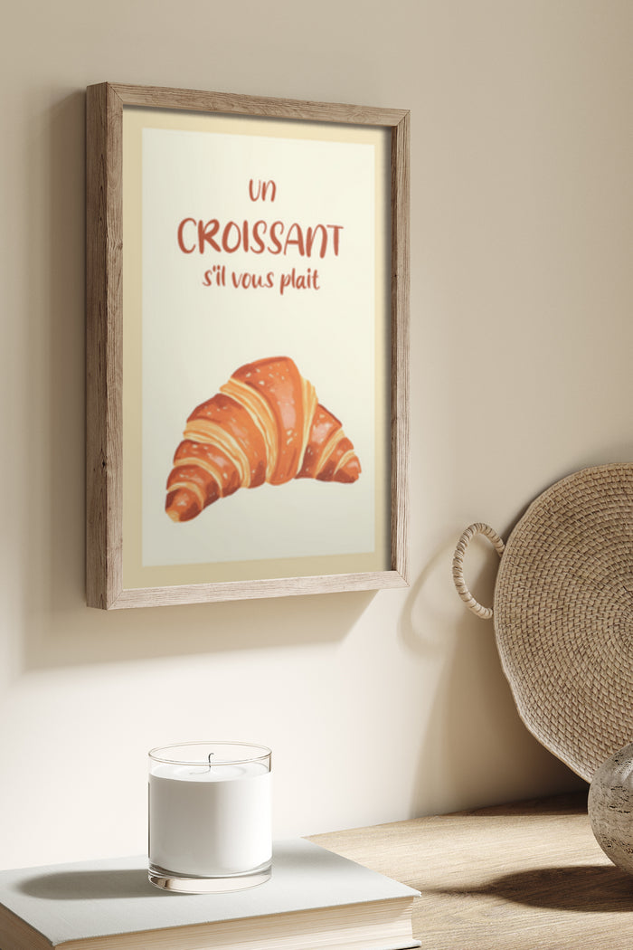 Framed poster artwork displaying a croissant with the text 'un Croissant s'il vous plait' in a cozy room setting