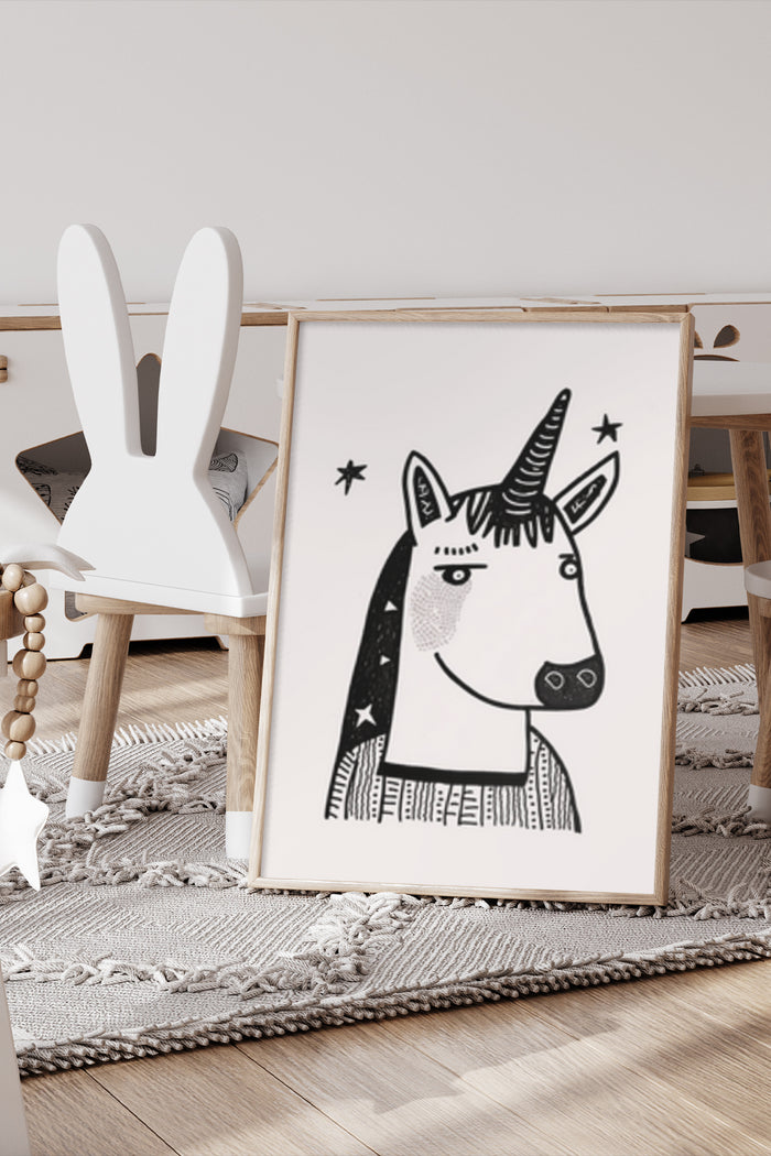 Black and white unicorn poster artwork displayed in a modern children's room setting