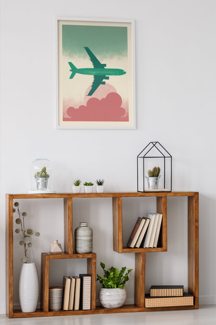 Retro style poster of airplane flying over clouds on a wall above wooden bookshelf with plants and books in home decor setting