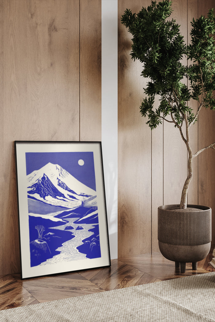 Vintage style blue and white Mount Fuji artwork framed and displayed in modern interior setting