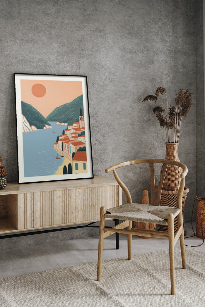 Vintage style poster of a coastal town during sunset with mountains and a sailboat, displayed in a modern living room setting