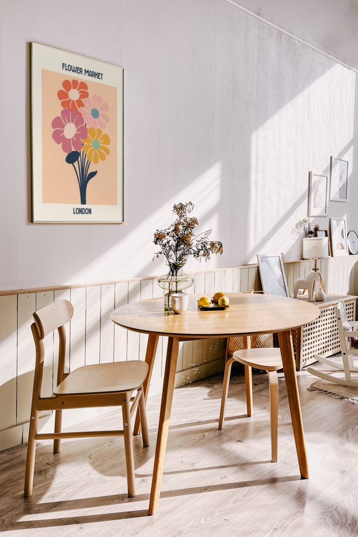 Vintage style Flower Market London poster on wall in modern dining room interior with wooden furniture