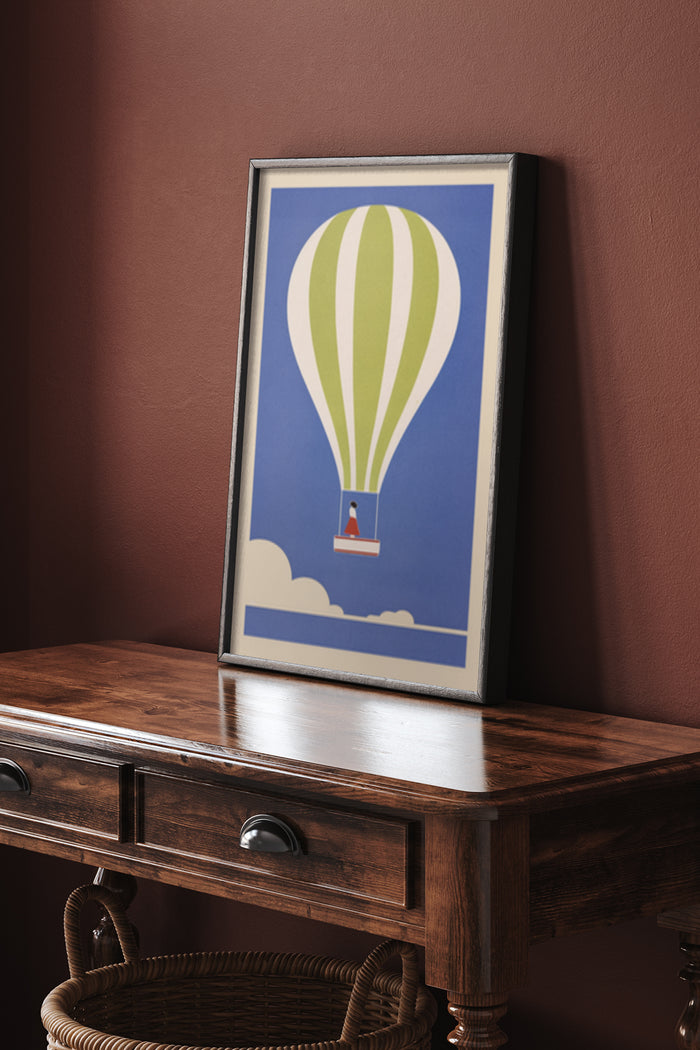 Framed vintage hot air balloon poster with clouds on blue background hung on a wall