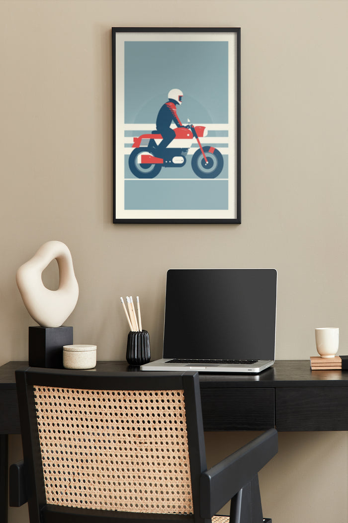 Vintage motorcycle poster featuring a rider in helmet on a red classic bike, wall art in modern home office setup with laptop and desk