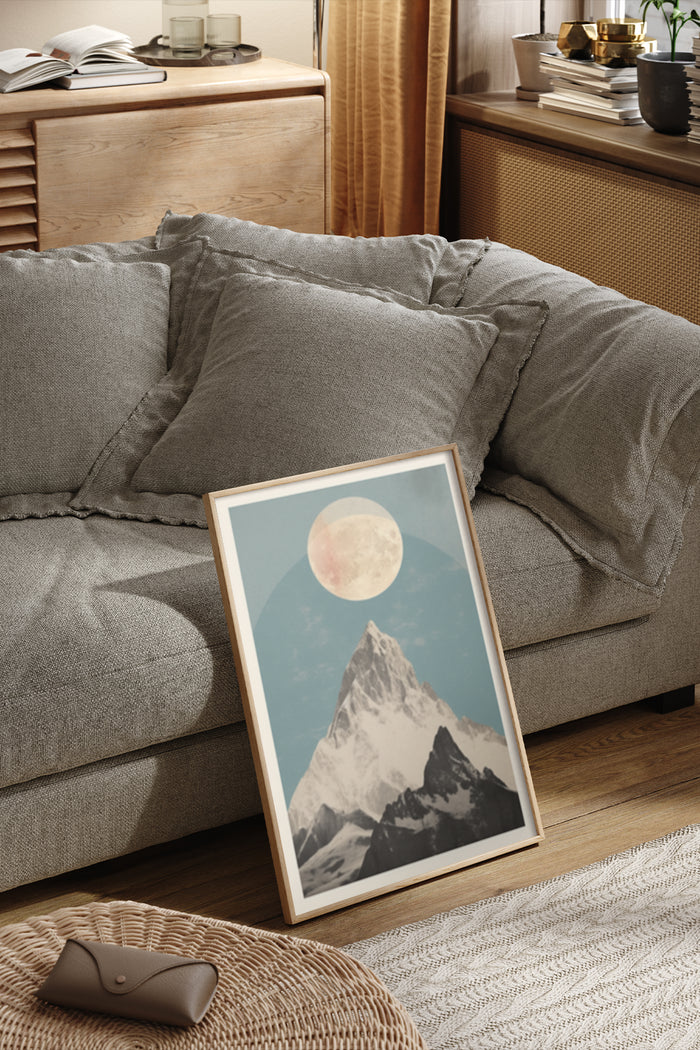 Vintage mountain and moon poster framed in modern living room decor