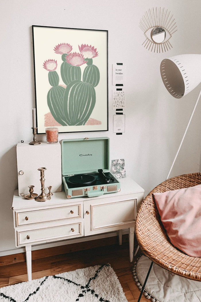 Stylish home interior featuring a vintage cactus flower poster, retro Crosley record player, and chic decor