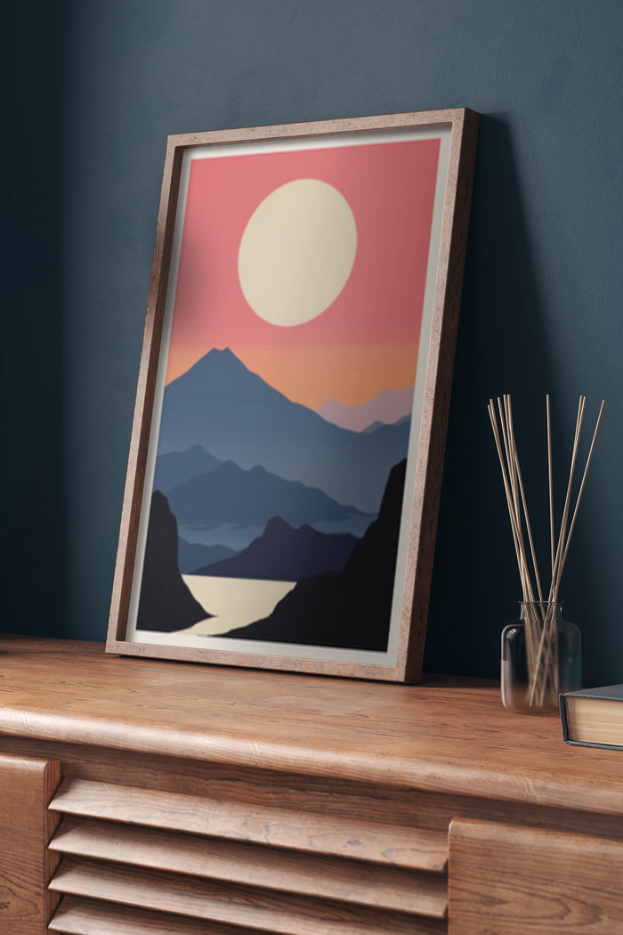 Framed vintage style poster of a mountain sunset with warm colors displayed in a modern interior setting