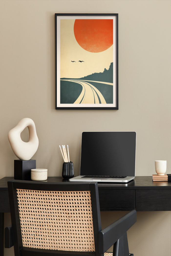 Vintage sunrise landscape poster with big sun and highway in a stylish home office setup