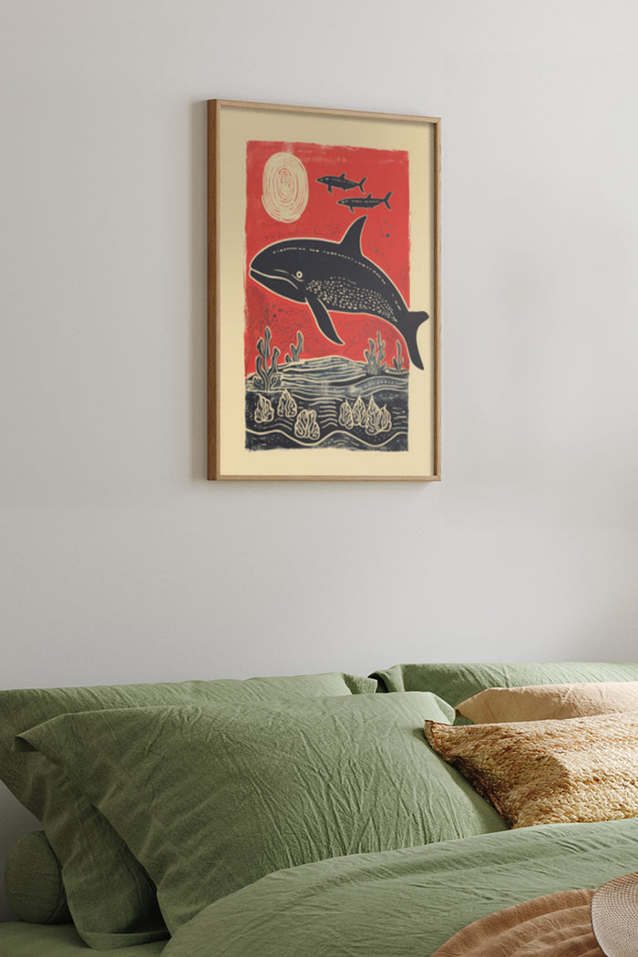 Vintage style red and black whale and ocean poster framed on bedroom wall