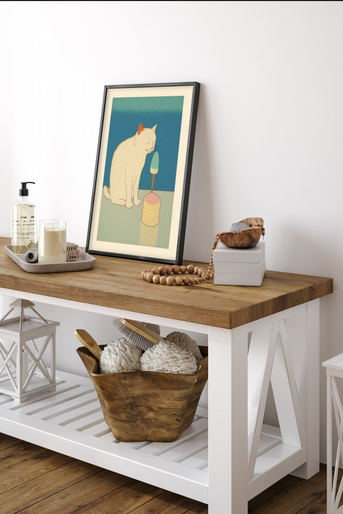 Illustration of a white cat staring at an ice cream cone on a poster, displayed in a stylish home interior