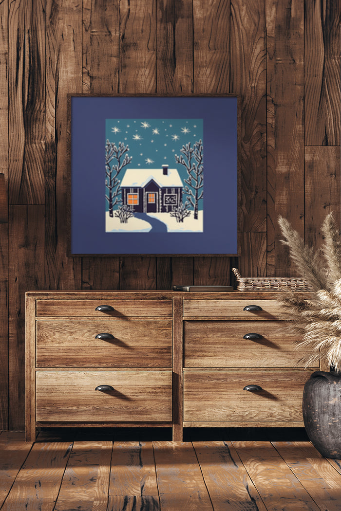 Winter cottage poster framed on wooden wall above chest of drawers in cozy interior setting